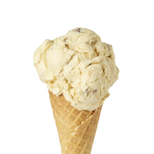 Waffle cone with a scoop of butter pecan ice cream on a white background