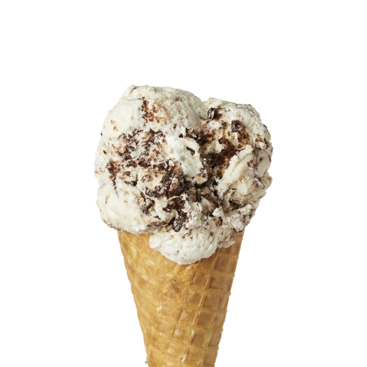 Campfire s'mores ice cream flavour in a waffle cone on a white background
