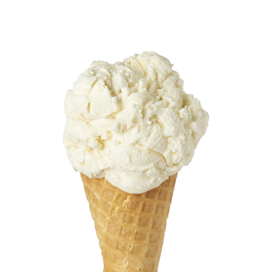 Single scoop of coconut flavoured ice cream in a waffle cone on a white background.